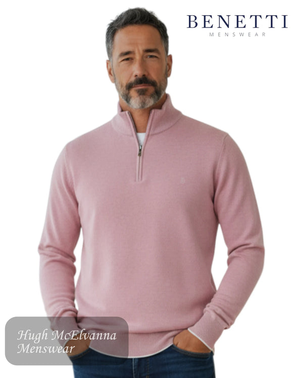Man wearing a rose half-zip sweater with 'Benetti Menswear' branding.