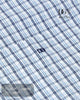 Close-up of a blue and white checkered fabric with a brand logo and text.