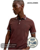 Mid-shot of a model posing in a Jack and Jones fire brick red polo shirt, featuring a 2 for £40 multibuys discount sticker.