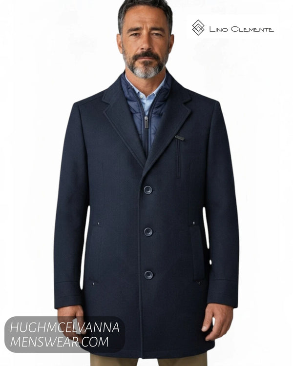 Close up front view of model wearing Lino Clemente SAKAI navy car coat showing quilted zip insert and lapels