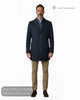 Full length studio model shot wearing Lino Clemente SAKAI navy herringbone car coat with beige chinos and brown shoes