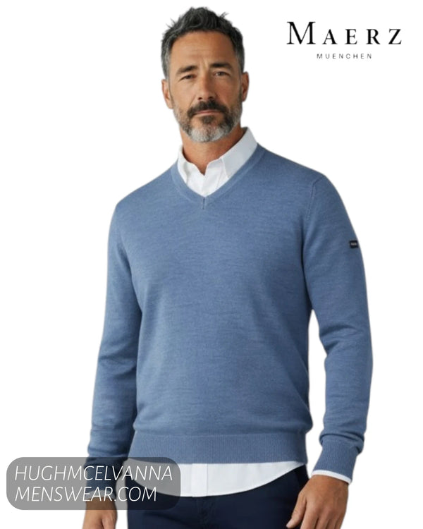 Model close up view wearing Maerz blue merino wool fine knit V neck sweater 490400