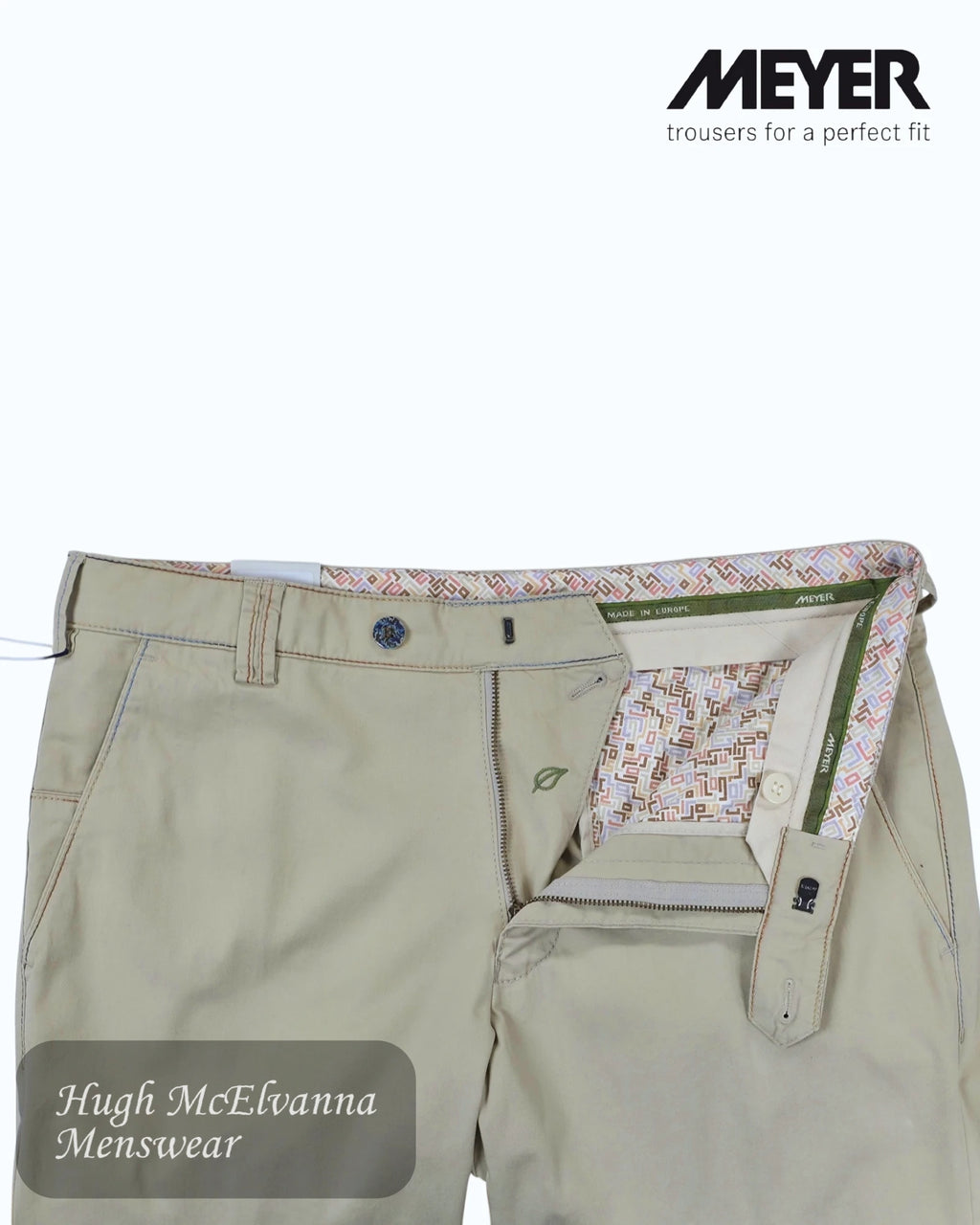 Beige pants with patterned lining on a white background, featuring the brand 'Meyer'.