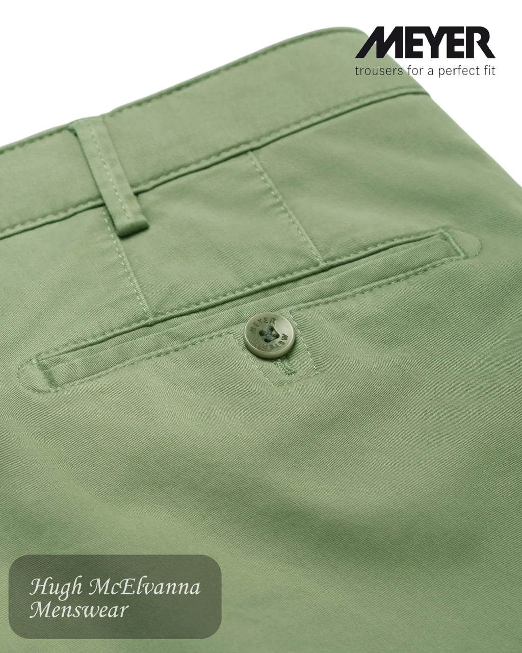 Close-up of green trousers with a button, featuring the brand 'Meyer' in style 3001/26