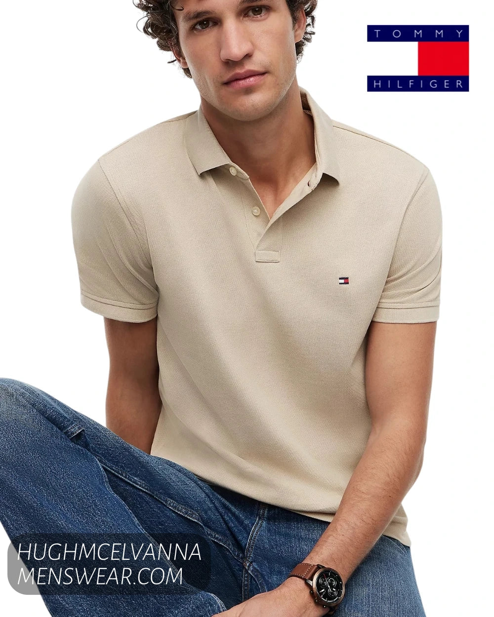 Close up seated shot of model wearing Tommy Hilfiger Sandalwood beige stretch polo shirt