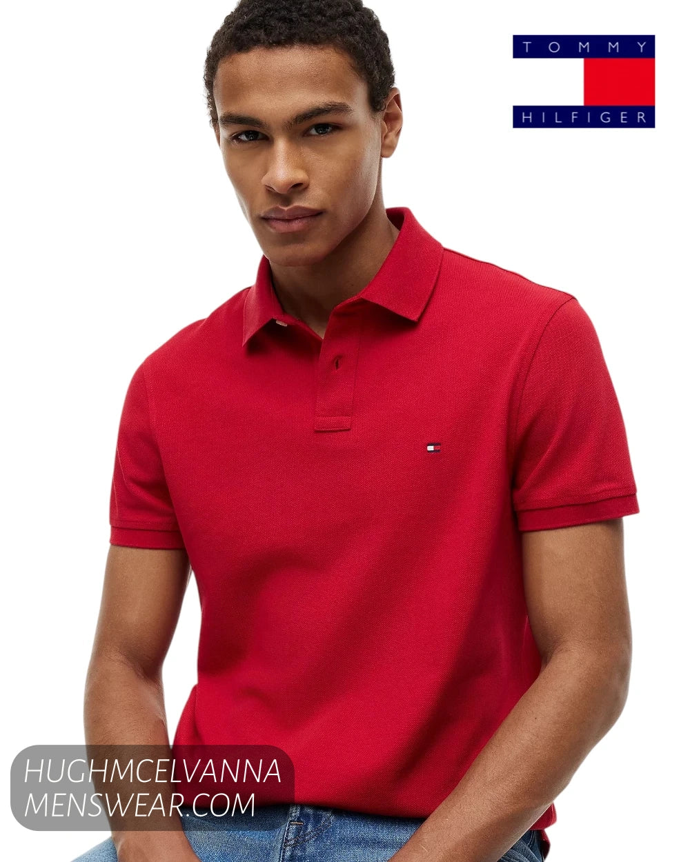 Close up seated shot of model wearing Tommy Hilfiger Medium Red regular fit stretch polo shirt