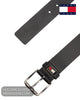 Flat lay view of Tommy Jeans Roller black full grain leather belt with buckle and flag logo keeper