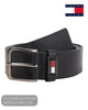Coiled studio shot of Tommy Jeans Roller black leather belt showing brushed metal roller buckle