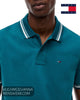 Close up collar and chest detail of Tommy Jeans Polar Teal tipped polo shirt showing buttons and embroidered flag badge