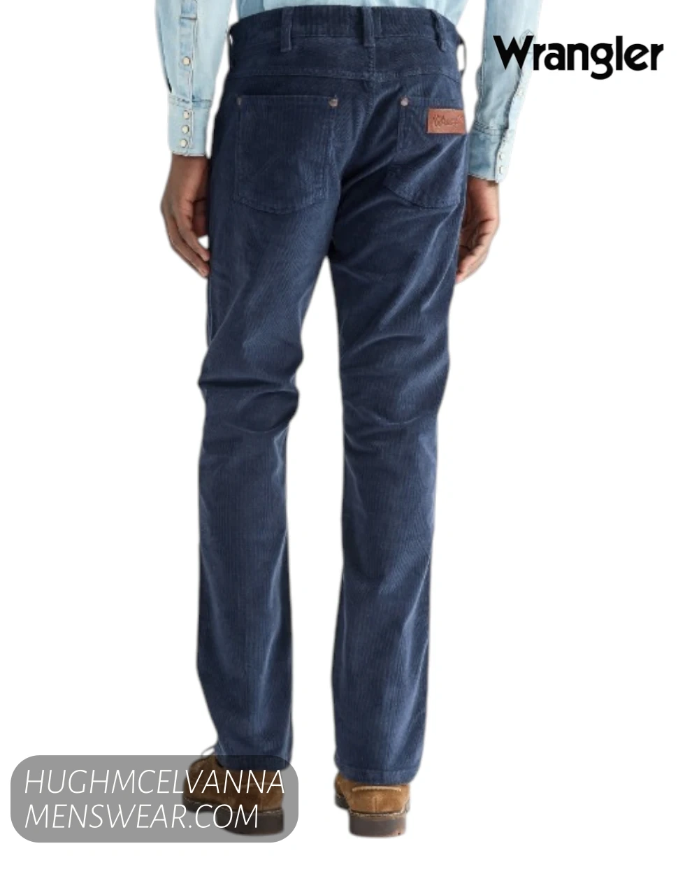 Full rear view of model wearing Wrangler Greensboro mood indigo blue straight leg cord trousers