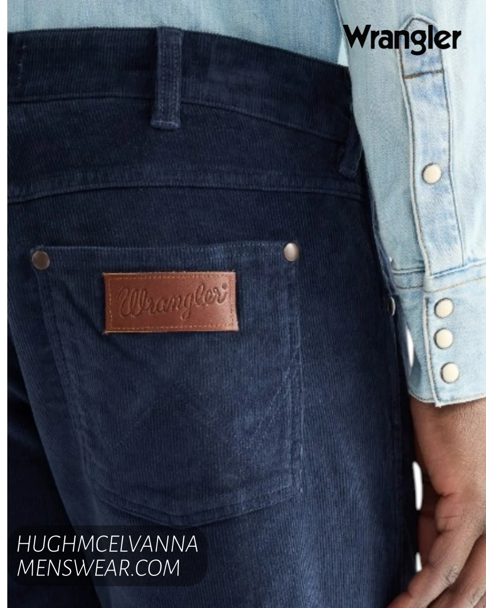 Rear pocket close up on Wrangler mood indigo cords showing iconic brown leather logo patch and W stitching