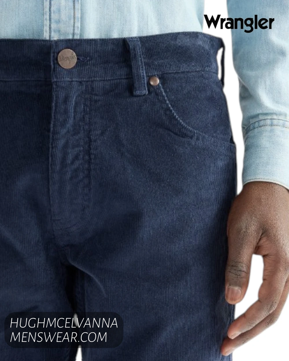 Front waist close up of Wrangler Greensboro mood indigo cords showing bronze branded button and coin pocket