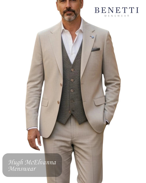 Man wearing a Benetti London beige suit with a vest, standing against a white background.