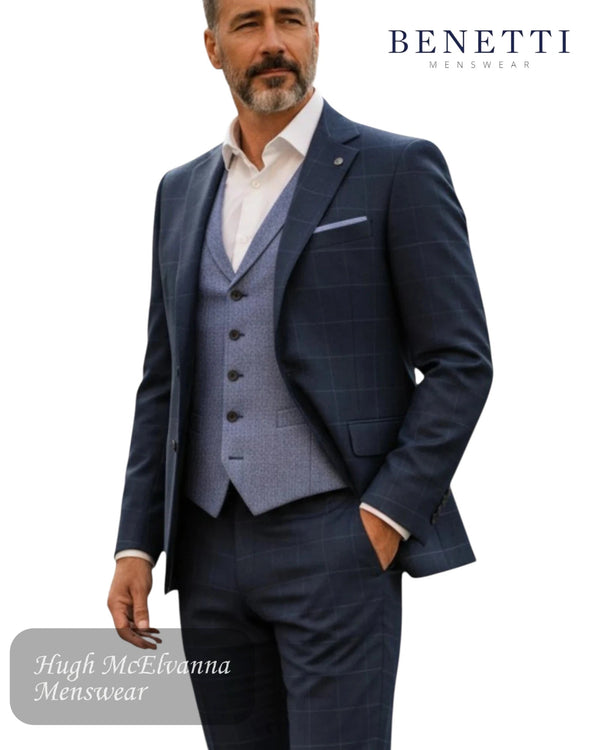 Oslo blue checkered suit with a white shirt, standing against a white background, featuring the Benetti Menswear brand.
