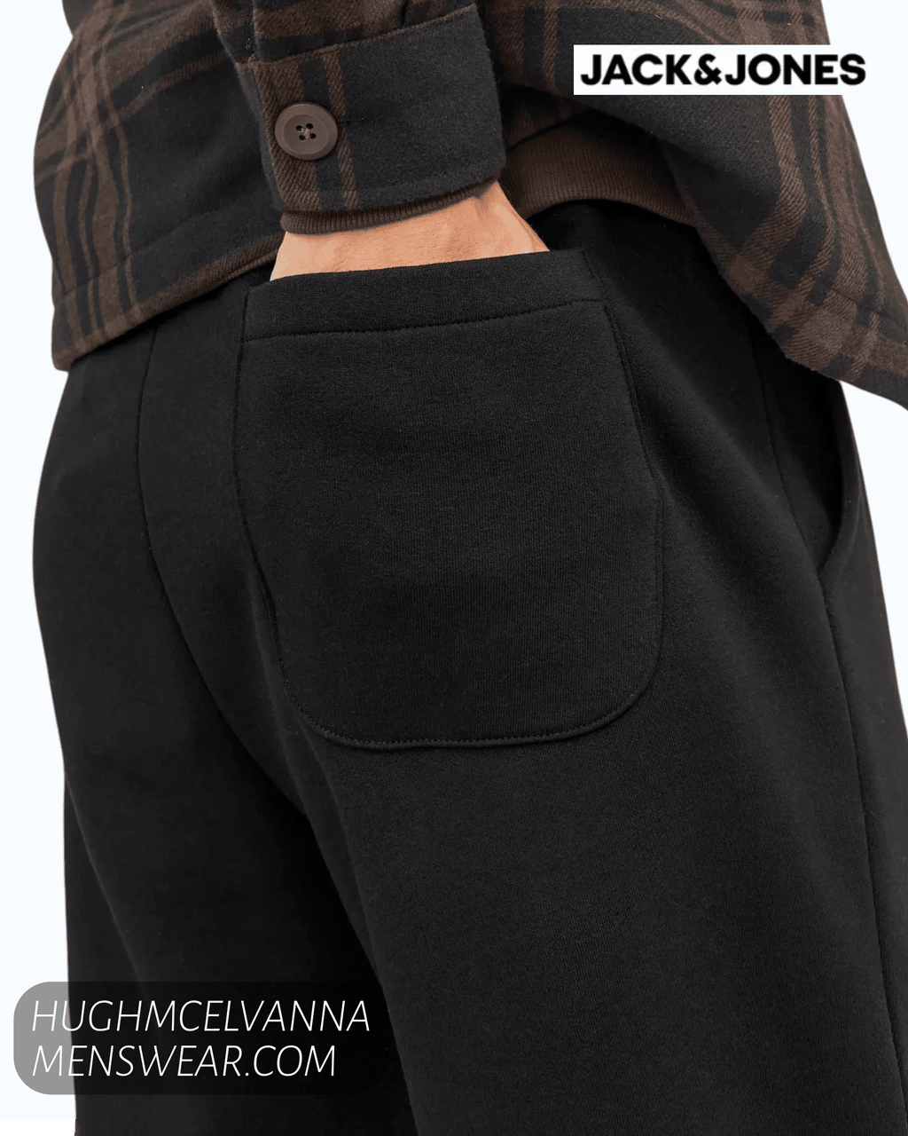 Smart-casual loungewear attire featuring regular fit black jogging bottoms paired with a premium hooded pullover.