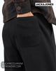 Smart-casual loungewear attire featuring regular fit black jogging bottoms paired with a premium hooded pullover.