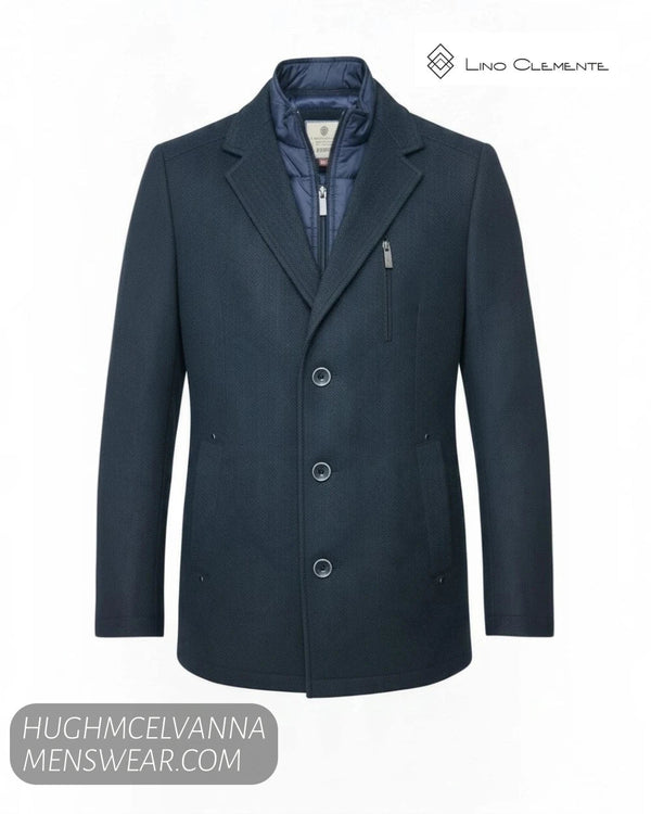 Studio ghost mannequin display of Lino Clemente SAKAI navy herringbone 2-in-1 car coat showing buttons and chest zip pocket