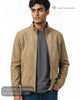 Close up front view of model wearing Lino Clemente URAL tan faux suede jacket