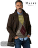 Mid shot of male model wearing Maerz Muenchen taupe argyle crew neck jumper layered under dark brown wool peacoat and blue denim jeans