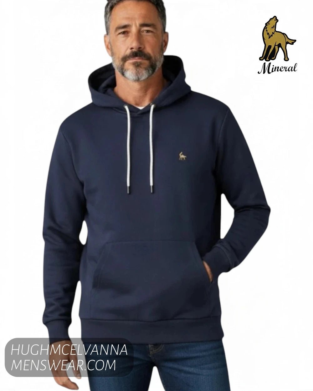 Close up front view of model wearing Mineral TYSON navy lightweight hoody showing white drawcords and embroidered wolf logo