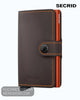 Secrid Miniwallet MM Matte Truffle & Orange compact brown leather wallet featuring an orange interior and a stud closure.