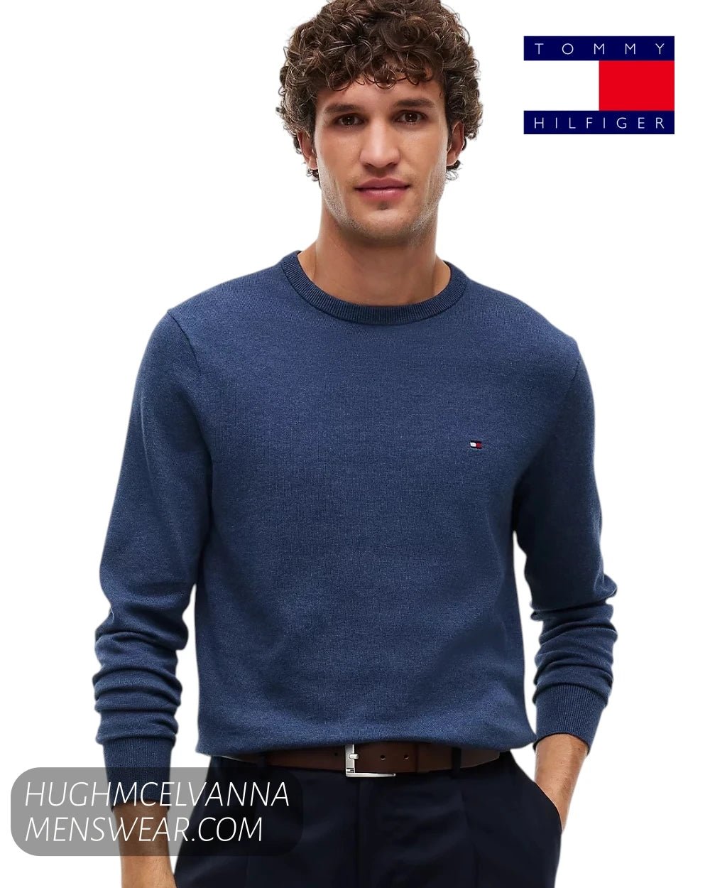 Front view of model wearing Tommy Hilfiger Aegean Sea blue crew neck pullover with embroidered flag logo