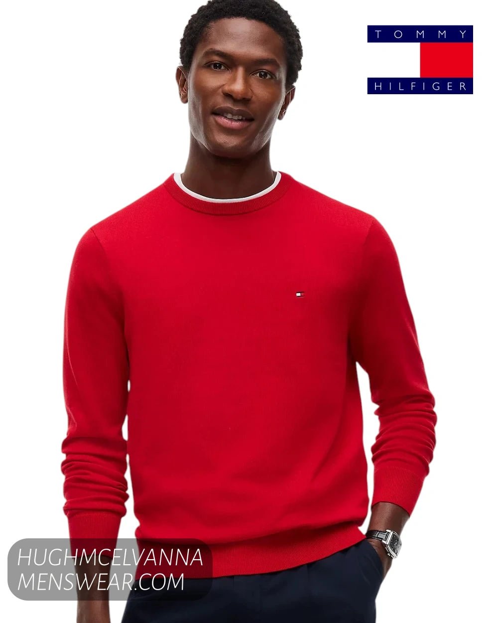 Front view of model wearing Tommy Hilfiger medium red crew neck jumper with embroidered flag logo