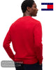 Rear view of male model wearing red Tommy Hilfiger jumper showing clean shoulder tailoring and rib hem