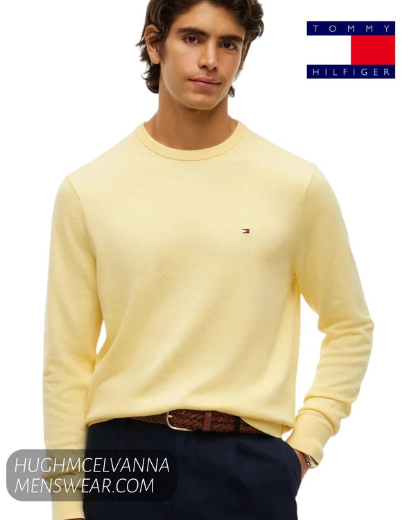 Front view of male model wearing Tommy Hilfiger Light Daffodil yellow crew neck jumper with chest flag logo