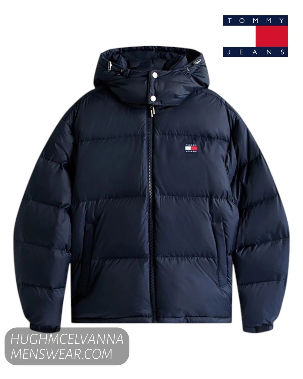 A navy blue hooded puffer jacket from Tommy Jeans, featuring horizontal quilting, a front zipper, and the signature Tommy Hilfiger flag logo on the left chest. 
