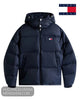 A navy blue hooded puffer jacket from Tommy Jeans, featuring horizontal quilting, a front zipper, and the signature Tommy Hilfiger flag logo on the left chest. 