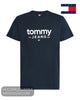 Flat lay product display of Tommy Jeans navy t-shirt featuring white 1985 logo print and flag emblem
