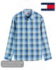A blue and white plaid long-sleeve button-up shirt by Tommy Jeans, shown flat against a white background with the brand logo in the top right corner.
