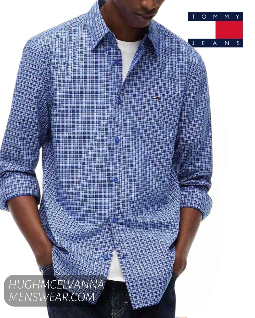 Standing three-quarter view of model wearing Tommy Jeans blue check long sleeve shirt with hands in pockets