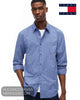 Front view of model wearing Tommy Jeans Providence Blue check shirt with sleeves rolled up over white t-shirt